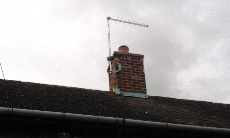 TV aerial with masthead amplifier on chimney