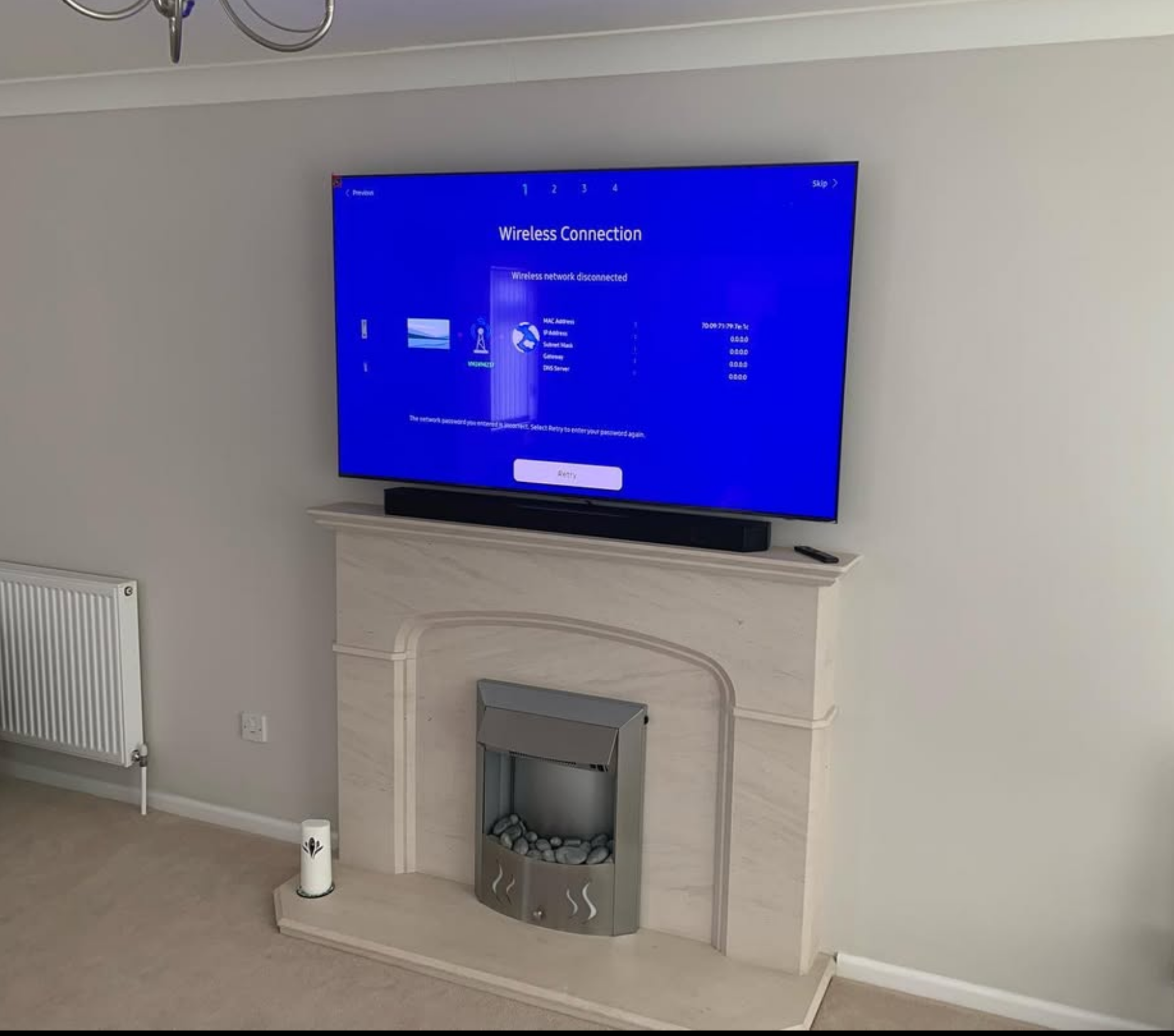 TV mounted above stone fireplace